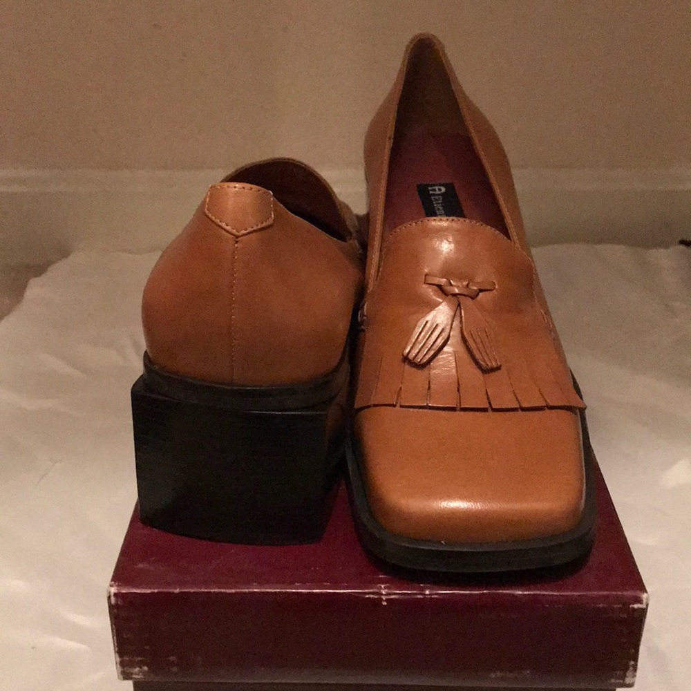 Brown loafers with a stacked heel